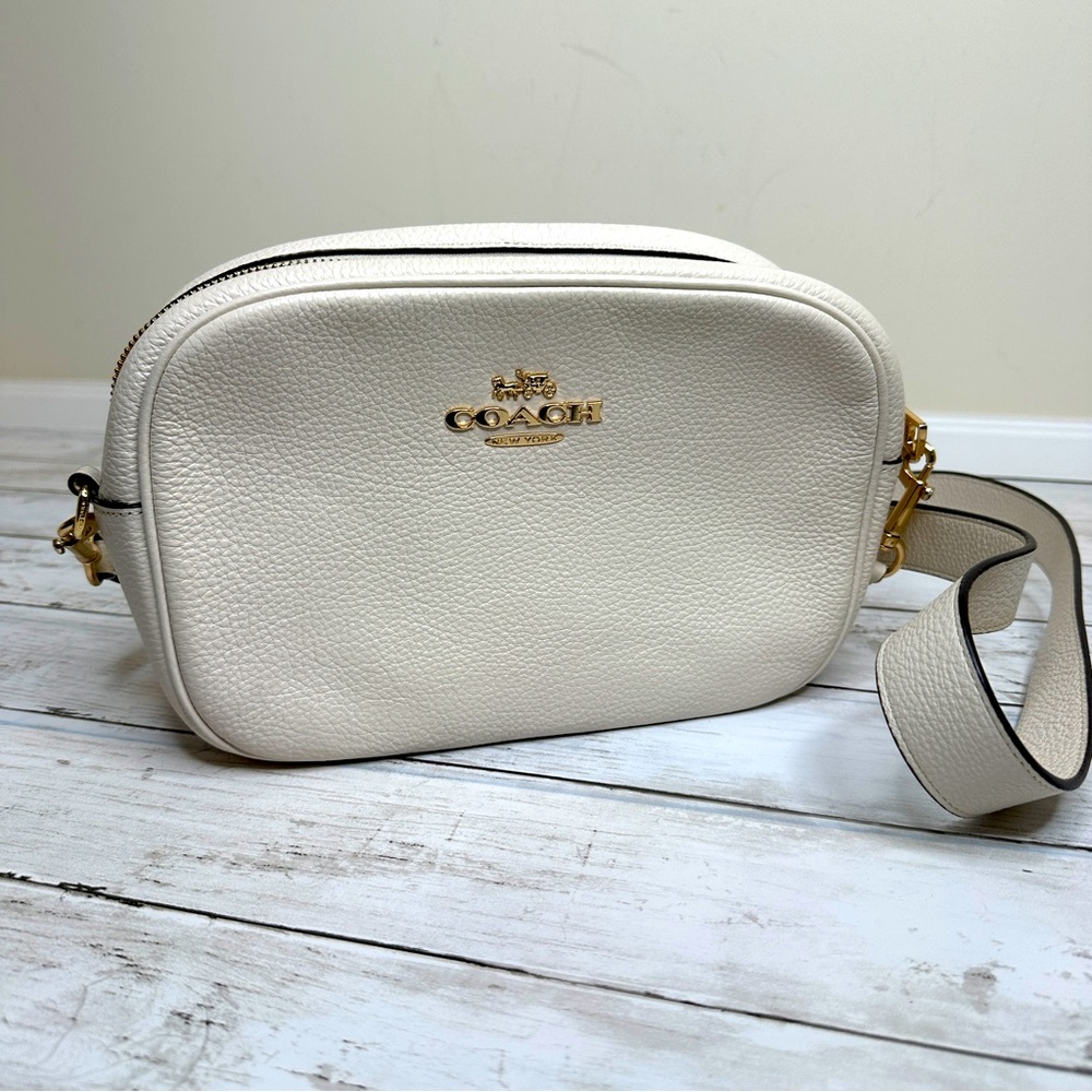 Coach “Jamie Camera” bag in the color cream